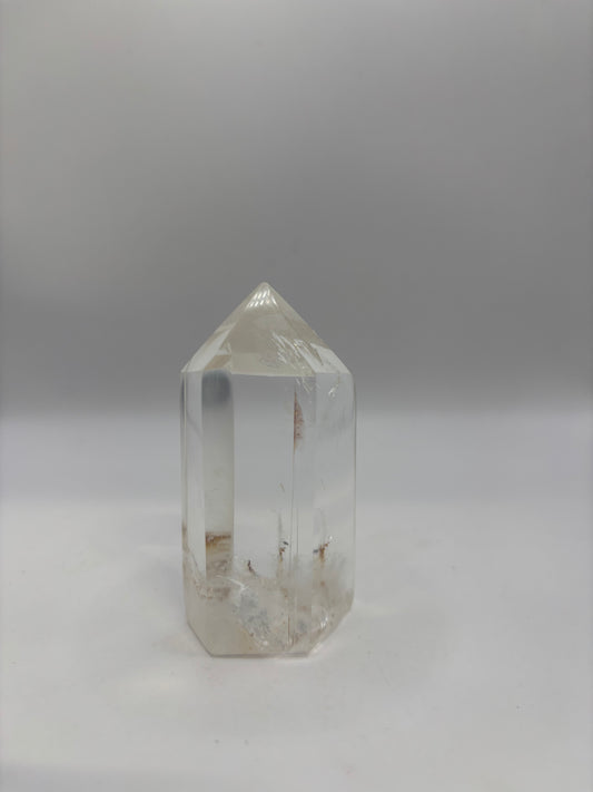 Crystal clear raw quartz point