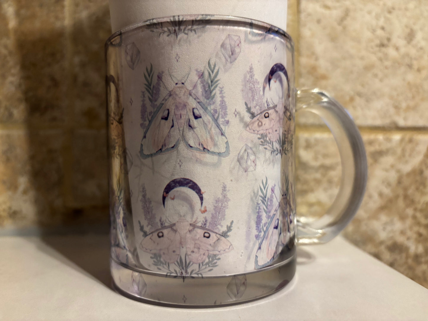 Glass mug with moths